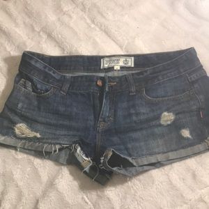 Dark cut off jean shorts with holes